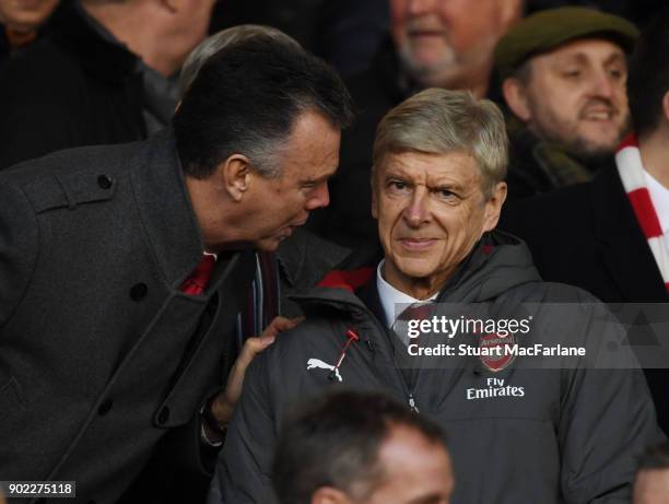 Arsenal manager Arsene Wenger talks to ex player and former Leeds United manager David O'Leary in the directors box before the FA Cup 3rd Round match...