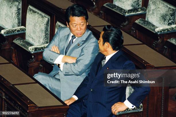 Ichiro Ozawa and Ryutaro Hashimoto talk prior to the 125th extraordinary session of the diet on October 30, 1992 in Tokyo, Japan.
