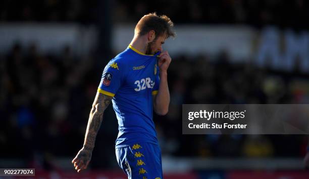 Dejected Leeds player Liam Cooper reacts after The Emirates FA Cup Third Round match between Newport County and Leeds United at Rodney Parade on...