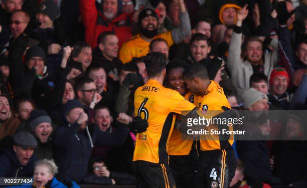 Newport County player Shawn McCoulsky celebrates his winning goal with fans and team mates during The Emirates FA Cup Third Round match between...