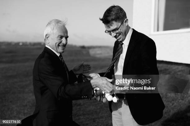 Jeremy Caplan the President of the Society is handed the President's putter by Andrew Dodds the honorary secretary of the Society for the traditional...