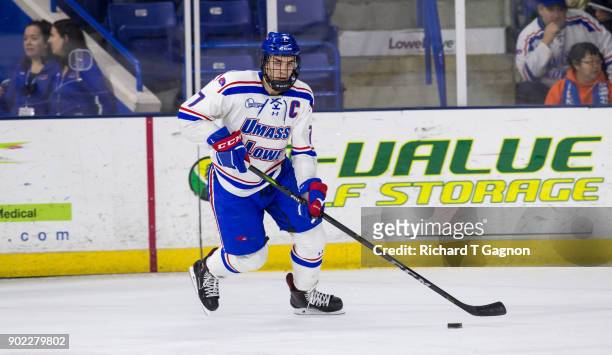 Tyler Mueller of the Massachusetts Lowell River Hawks skates against the Vermont Catamounts during NCAA men's hockey at the Tsongas Center on January...