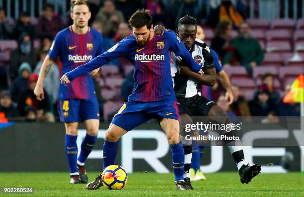 Emmanuel Boateng and Leo Messi during theLa Liga match between FC Barcelona and Levante UD, in Barcelona, on January 07, 2018.