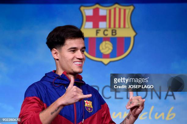 Barcelona's new Brazilian midfielder Philippe Coutinho poses for a picture in Barcelona on January 7, 2018. Coutinho is in Barcelona to tie up a...