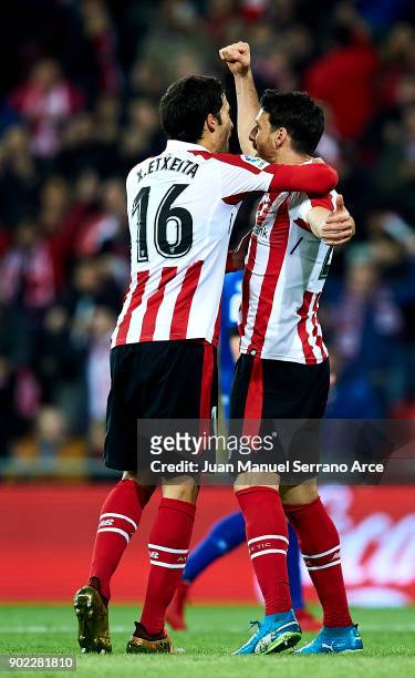 Aritz Aduriz of Athletic Club celebrates with his teammates Xabier Etxeita of Athletic Club after scoring his team's second goal during the La Liga...