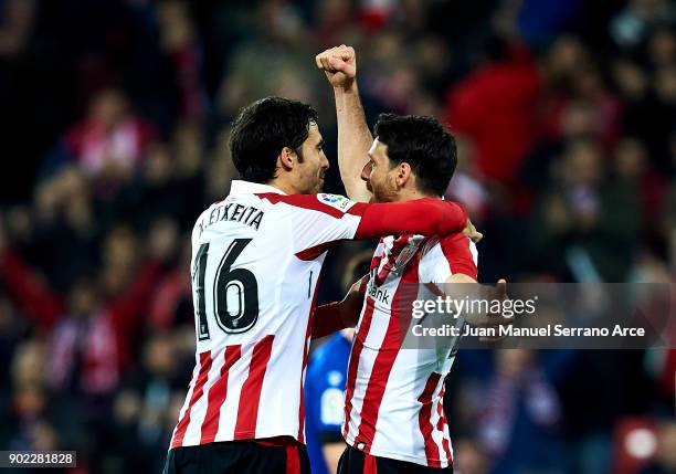 Aritz Aduriz of Athletic Club celebrates with his teammates Xabier Etxeita of Athletic Club after scoring his team's second goal during the La Liga...