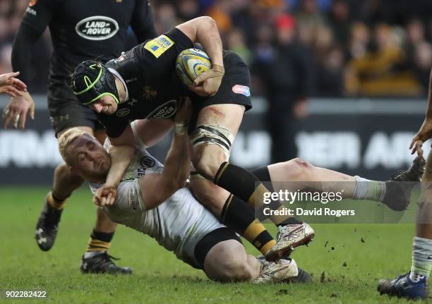 James Gaskell of Wasps is tackled by Vincent Koch during the Aviva Premiership match between Wasps and Saracens at The Ricoh Arena on January 7, 2018...