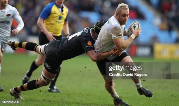 Vincent Koch of Saracens is tackled by James Gaskell during the Aviva Premiership match between Wasps and Saracens at The Ricoh Arena on January 7,...