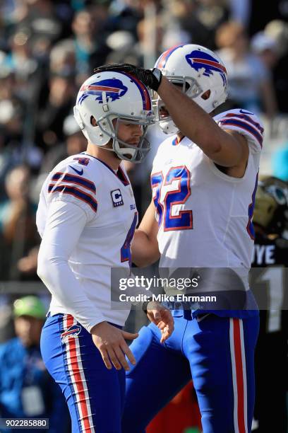 Kicker Stephen Hauschka of the Buffalo Bills celebrates with Logan Thomas after kicking a second quarter field goal against the Jacksonville Jaguars...