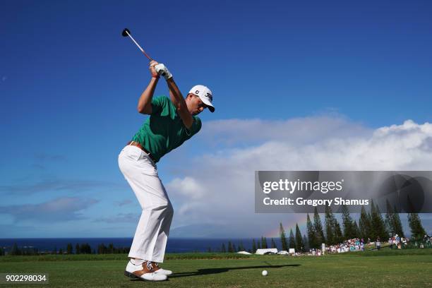 Justin Thomas of the United States plays his shot from the first tee during the final round of the Sentry Tournament of Champions at Plantation...