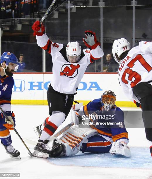 Miles Wood of the New Jersey Devils scores at 2:41 of the third period against Jaroslav Halak of the New York Islanders at the Barclays Center on...