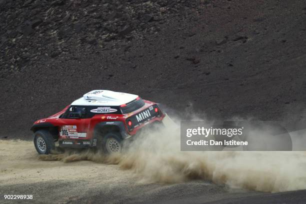 Mikko Hirvonen of Finland and Mini X-Raid drives with co-driver Andreas Schulz of Germany in the Mini John Cooper Works Buggy car in the Classe :...