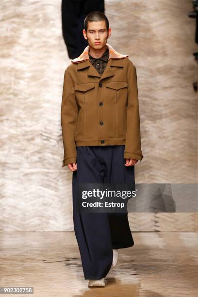 Model walks the runway at the Qasami show during London Fashion Week Men's January 2018 at 100 Sydney Street on January 6, 2018 in London, England.