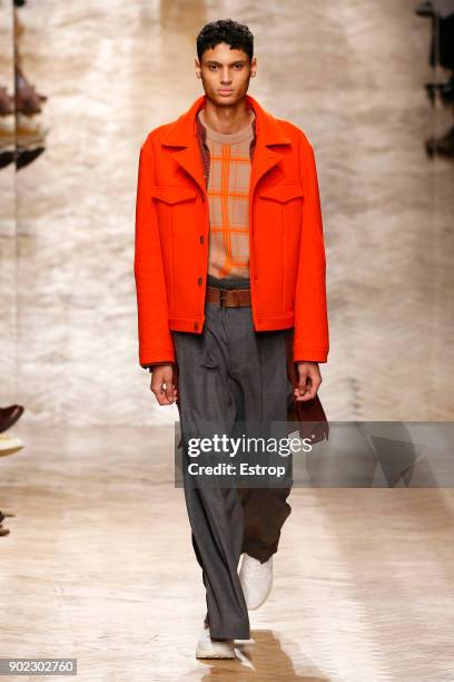 Model walks the runway at the Qasami show during London Fashion Week Men's January 2018 at 100 Sydney Street on January 6, 2018 in London, England.