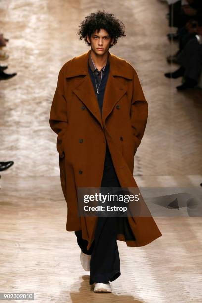 Model walks the runway at the Qasami show during London Fashion Week Men's January 2018 at 100 Sydney Street on January 6, 2018 in London, England.