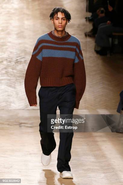 Model walks the runway at the Qasimi show during London Fashion Week Men's January 2018 at 100 Sydney Street on January 6, 2018 in London, England.