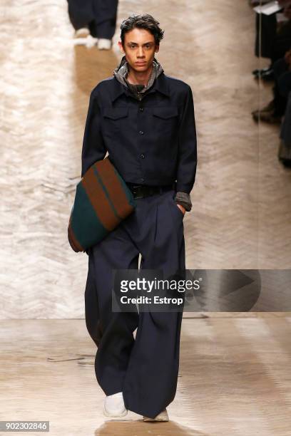 Model walks the runway at the Qasimi show during London Fashion Week Men's January 2018 at 100 Sydney Street on January 6, 2018 in London, England.