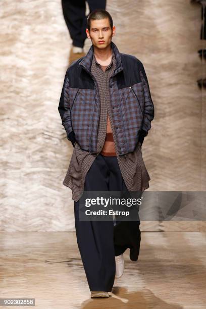 Model walks the runway at the Qasimi show during London Fashion Week Men's January 2018 at 100 Sydney Street on January 6, 2018 in London, England.