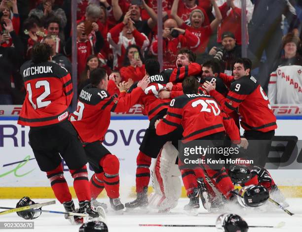 Team Canada celebrates after winning against Sweden during the Gold medal game of the IIHF World Junior Championship at KeyBank Center on January 5,...