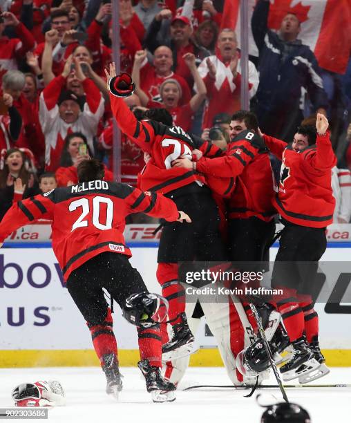 Team Canada celebrates after winning against Sweden during the Gold medal game of the IIHF World Junior Championship at KeyBank Center on January 5,...