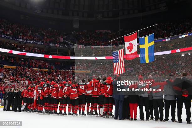 Team Canada stands together for the national anthem after the Gold medal game against Sweden of the IIHF World Junior Championship at KeyBank Center...