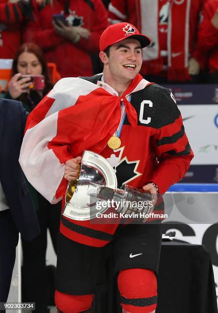 Dillon Dubé of Canada with the tournament trophy after Canada won against Sweden during the Gold medal game of the IIHF World Junior Championship at...