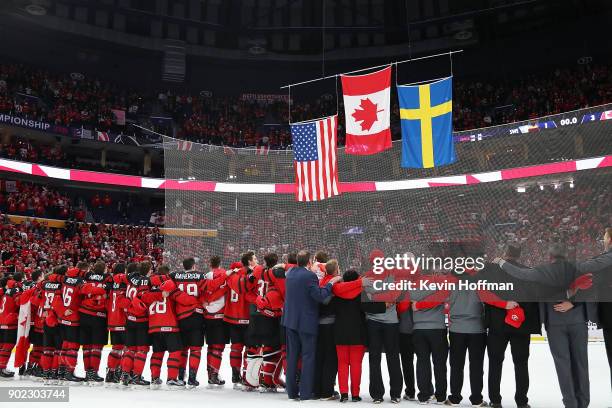 Team Canada stands together for the national anthem after the Gold medal game against Sweden of the IIHF World Junior Championship at KeyBank Center...