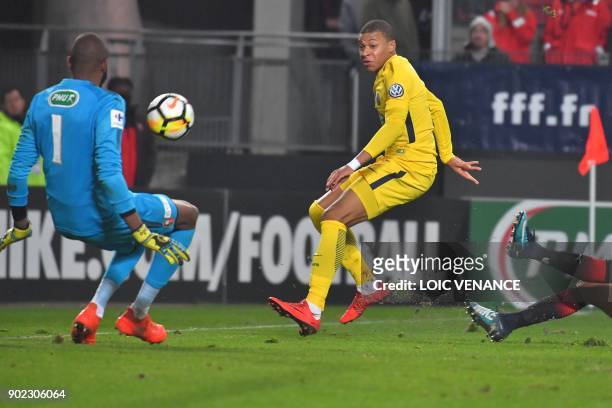 Rennes' French goalkeeper Abdoulaye Diallo fights for the ball with Paris Saint-Germain's French forward Kylian Mbappe during the French Cup football...