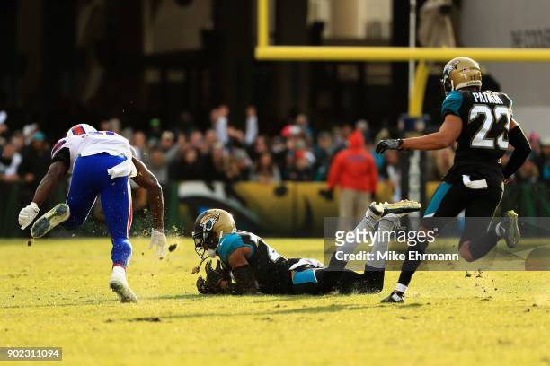 Cornerback Jalen Ramsey of the Jacksonville Jaguars intercepts a pass late in the fourth quarter against the Buffalo Bills during the AFC Wild Card...