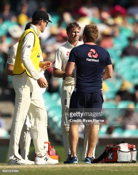 Joe Root of England seeks medical attention during day four of the Fifth Test match in the 2017/18 Ashes Series between Australia and England at...