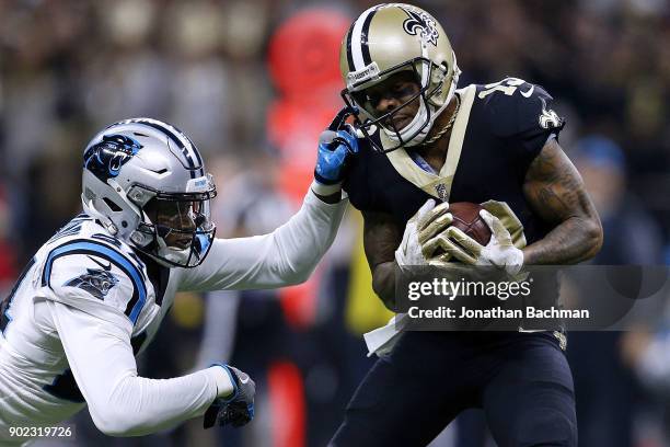 Ted Ginn of the New Orleans Saints catches the ball for a touchdown as James Bradberry of the Carolina Panthers defends during the first half of the...