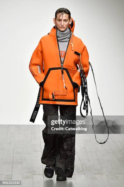 Model walks the runway at the Christopher Raeburn Autumn Winter 2018 fashion show during London Menswear Fashion Week on January 7, 2018 in London,...