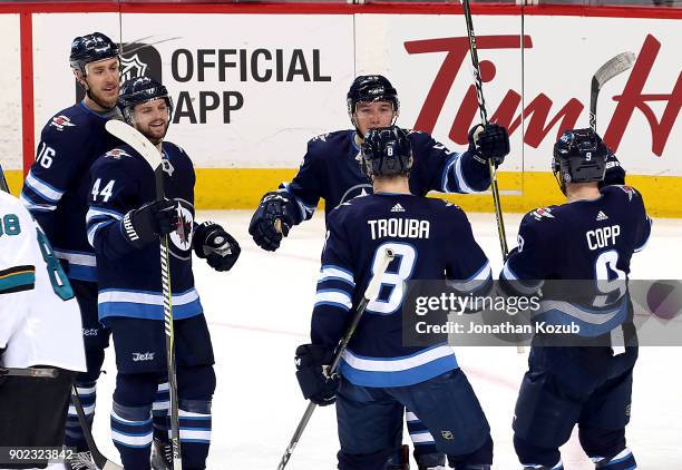 Shawn Matthias, Josh Morrissey, Marko Dano, Jacob Trouba and Andrew Copp of the Winnipeg Jets celebrate a second period goal against the San Jose...