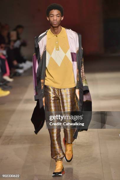 Model walks the runway at the Astrid Andersen Autumn Winter 2018 fashion show during London Menswear Fashion Week on January 7, 2018 in London,...