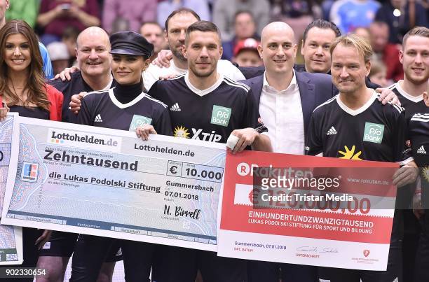 Sophia Thomalla, Lukas Podolski and Markus Krampe attend the Schauinsland Reisen Cup 2018 at Schwalbe Arena on January 7, 2018 in Gummersbach,...