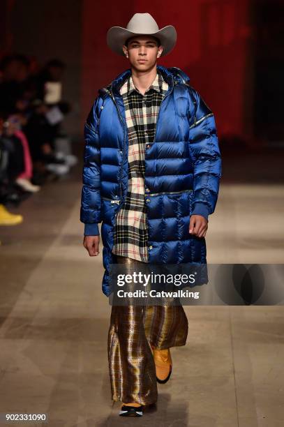 Model walks the runway at the Astrid Andersen Autumn Winter 2018 fashion show during London Menswear Fashion Week on January 7, 2018 in London,...