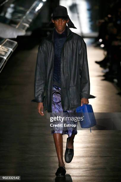 Model walks the runway at the Cottweiler show during London Fashion Week Men's January 2018 at Natural History Museum on January 6, 2018 in London,...