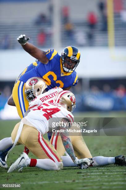 Elvis Dumervil of the San Francisco 49ers sacks Sean Mannion of the Los Angeles Rams during the game at Los Angeles Memorial Coliseum on December 31,...