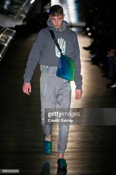 Model walks the runway at the Cottweiler show during London Fashion Week Men's January 2018 at Natural History Museum on January 6, 2018 in London,...