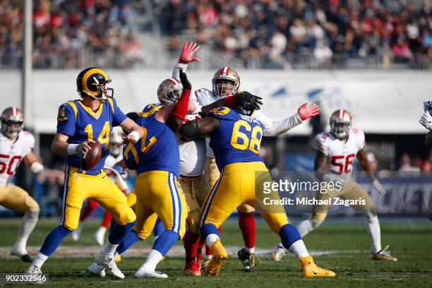 Sean Mannion of the Los Angeles Rams looks for an open receiver during the game against the San Francisco 49ers at Los Angeles Memorial Coliseum on...