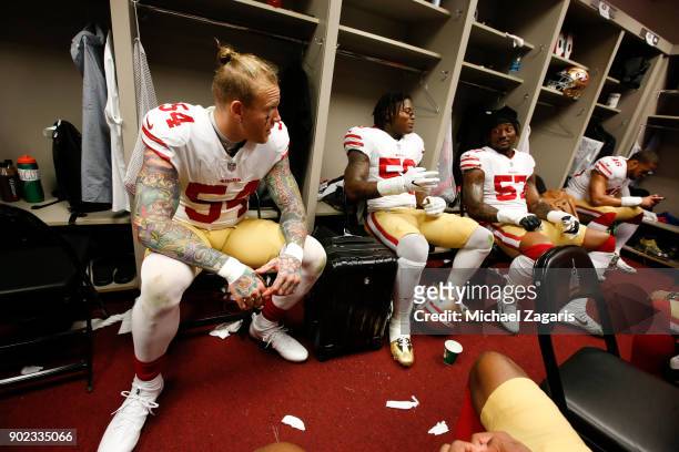 Cassius Marsh, Reuben Foster and Eli Harold of the San Francisco 49ers relax in the locker room prior to the game against the Los Angeles Rams at Los...