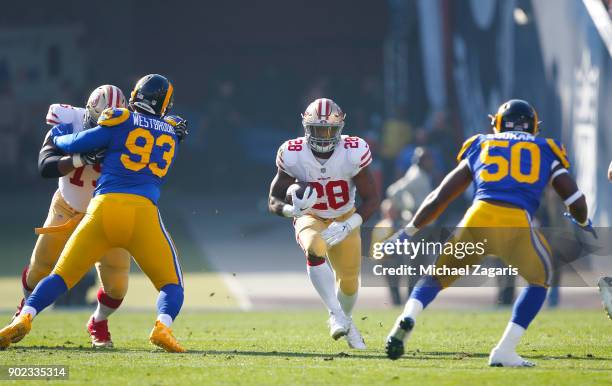 Carlos Hyde of the San Francisco 49ers rushes during the game against the Los Angeles Rams at Los Angeles Memorial Coliseum on December 31, 2017 in...