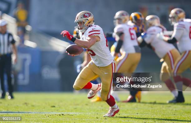 George Kittle of the San Francisco 49ers runs after making a reception during the game against the Los Angeles Rams at Los Angeles Memorial Coliseum...