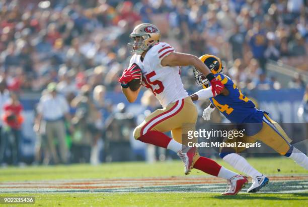 George Kittle of the San Francisco 49ers runs after making a reception during the game against the Los Angeles Rams at Los Angeles Memorial Coliseum...