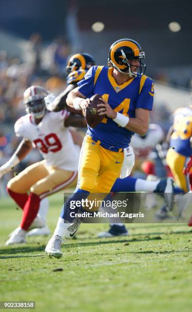 Sean Mannion of the Los Angeles Rams rolls out during the game against the San Francisco 49ers at Los Angeles Memorial Coliseum on December 31, 2017...