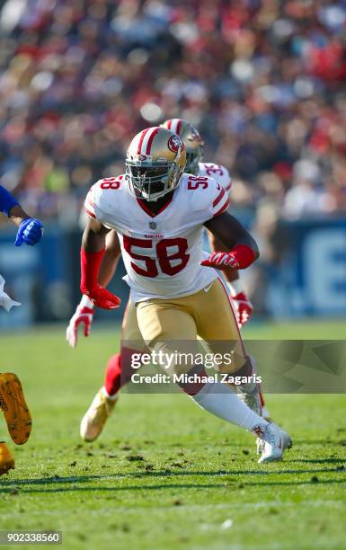 Elvis Dumervil of the San Francisco 49ers rushes the quarterback during the game against the Los Angeles Rams at Los Angeles Memorial Coliseum on...