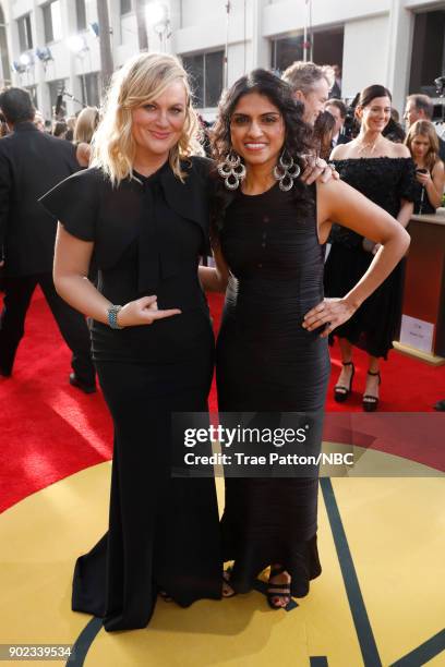 75th ANNUAL GOLDEN GLOBE AWARDS -- Pictured: Actor Amy Poehler and Saru Jayaraman arrive to the 75th Annual Golden Globe Awards held at the Beverly...