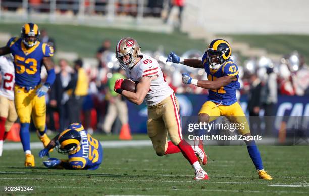 George Kittle of the San Francisco 49ers breaks free of a tackle after making a reception during the game against the Los Angeles Rams at Los Angeles...