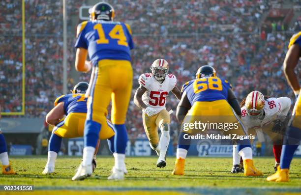 Reuben Foster of the San Francisco 49ers blitzes during the game against the Los Angeles Rams at Los Angeles Memorial Coliseum on December 31, 2017...