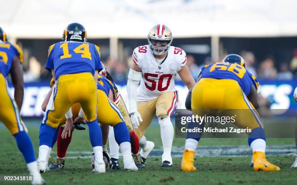 Brock Coyle of the San Francisco 49ers eyes the quarterback during the game against the Los Angeles Rams at Los Angeles Memorial Coliseum on December...